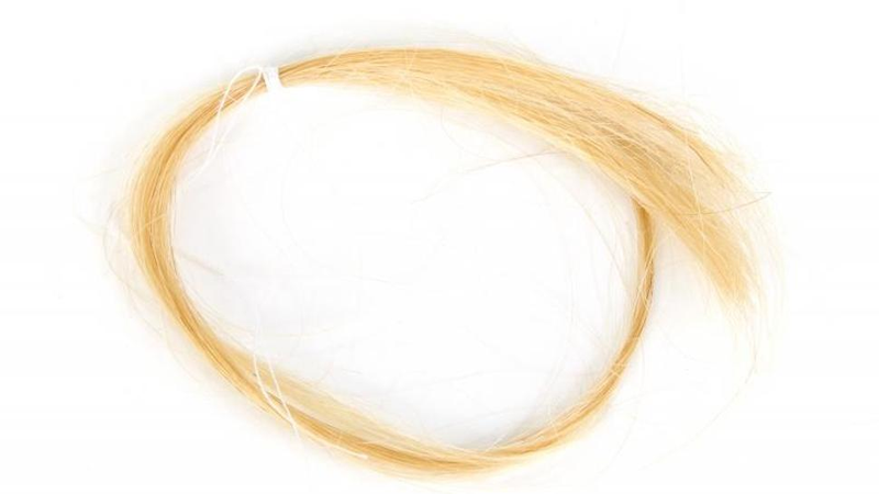 Illustration for article titled Frances Bean Has a Creepy Doll Made With Locks of Kurt Cobain's Hair